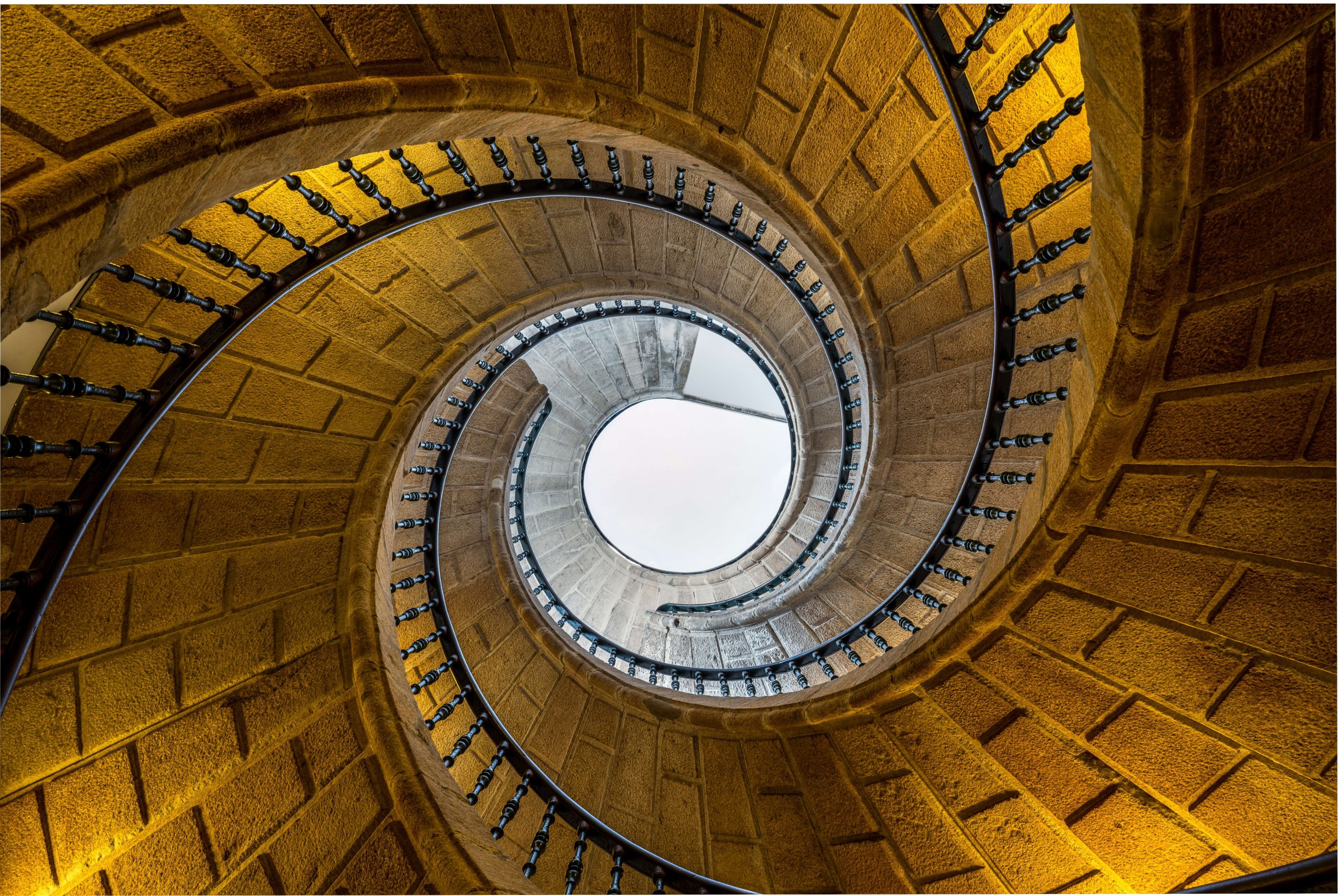 Worm's eye view of brick spiral staircase