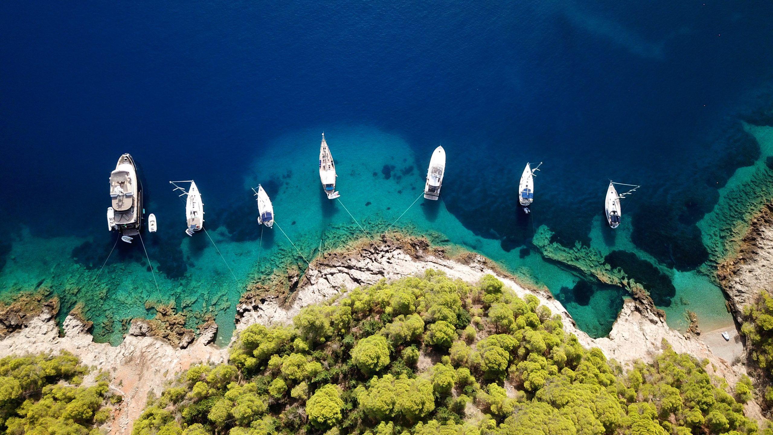 Boats anchored at an island 